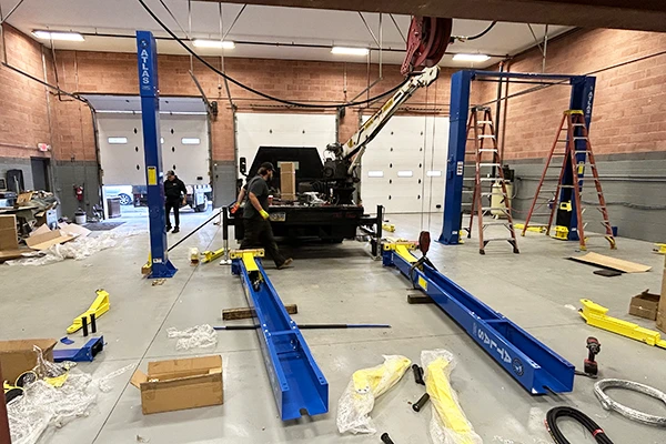 Garage Services team members in an outdoor booth